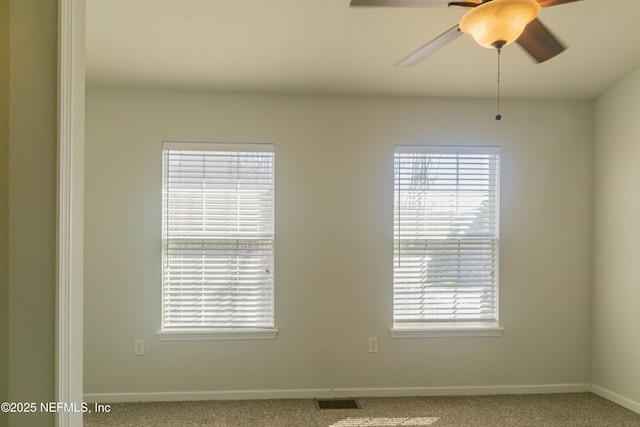 unfurnished room with carpet floors, plenty of natural light, and ceiling fan