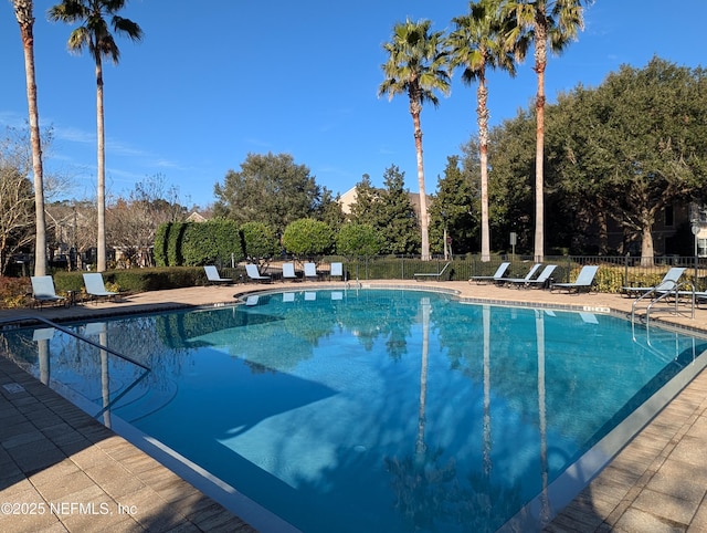 view of swimming pool with a patio area