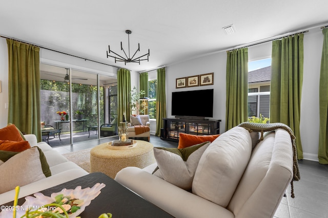 tiled living room with a chandelier