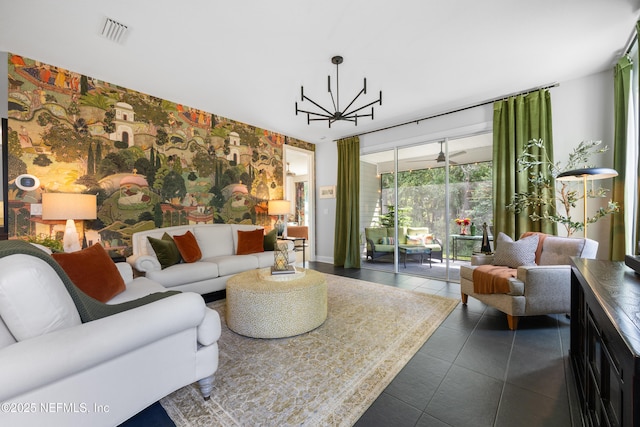 tiled living room featuring an inviting chandelier