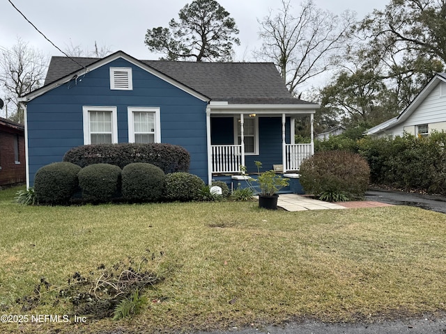 bungalow-style house with covered porch and a front yard