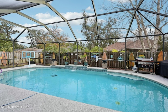 view of swimming pool featuring a grill and a lanai