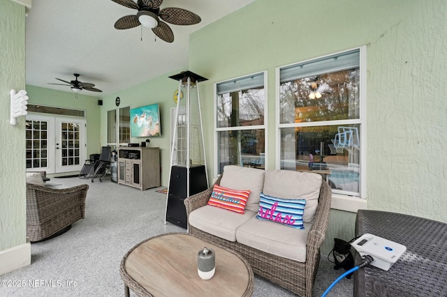 sunroom with french doors and ceiling fan