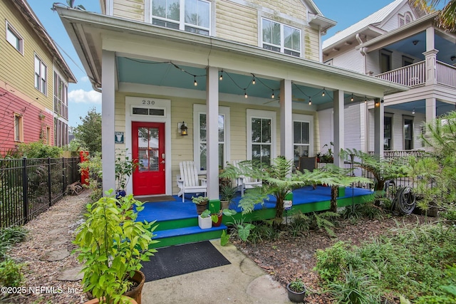 entrance to property featuring covered porch