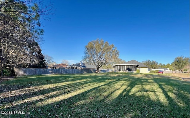 view of yard featuring a sunroom