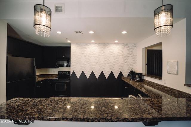 kitchen with decorative light fixtures, black appliances, kitchen peninsula, and dark stone counters