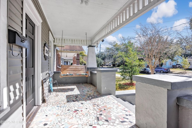 view of patio featuring covered porch