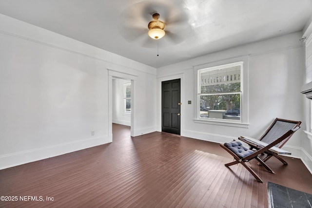 unfurnished room featuring dark hardwood / wood-style floors and ceiling fan