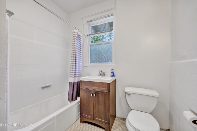 full bathroom with vanity, shower / tub combo, and toilet