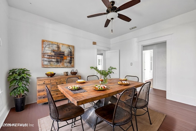 dining area with dark hardwood / wood-style floors and ceiling fan