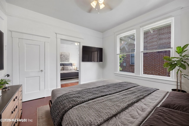 bedroom featuring dark wood-type flooring and ceiling fan