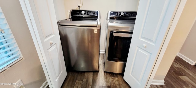 washroom featuring separate washer and dryer and dark wood-type flooring