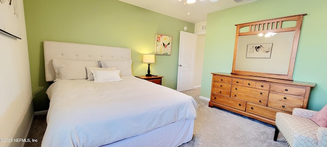 bedroom featuring light colored carpet