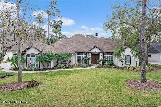 view of front facade featuring a front yard