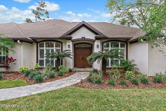 single story home featuring a front lawn