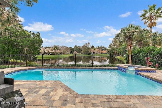 view of pool with an in ground hot tub, a patio area, and a water view