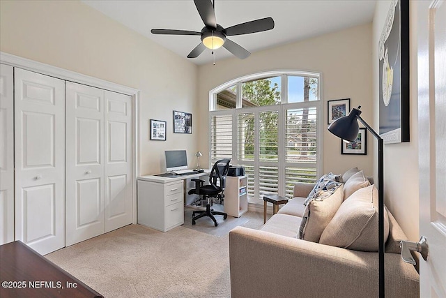 office area with ceiling fan and light colored carpet