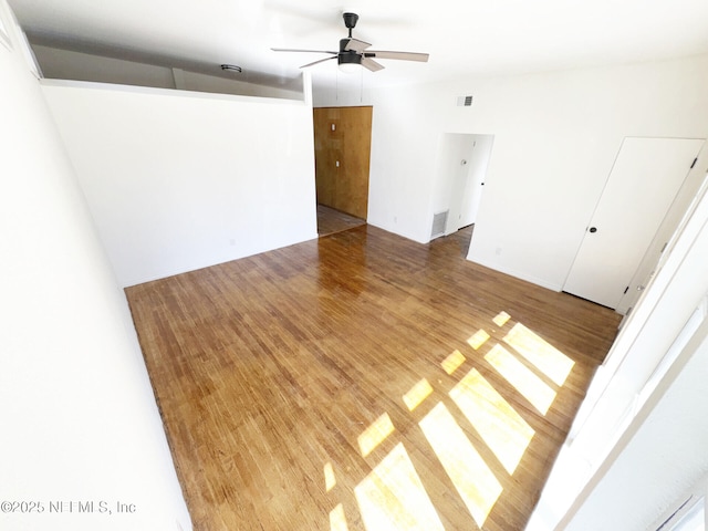 spare room featuring hardwood / wood-style flooring and ceiling fan