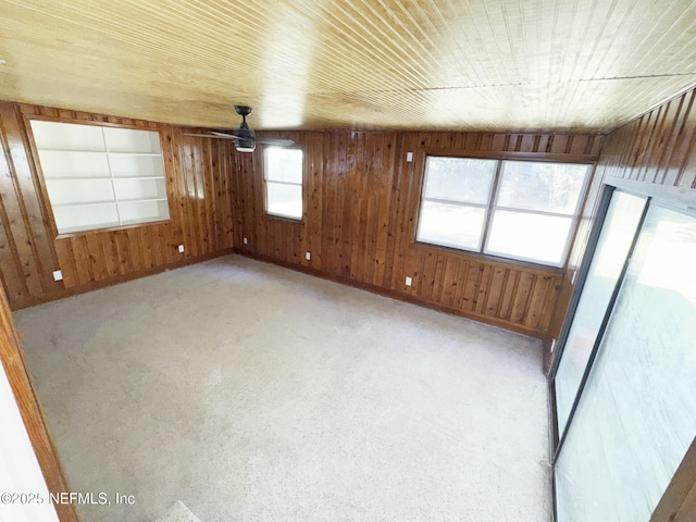 spare room with ceiling fan and wooden ceiling