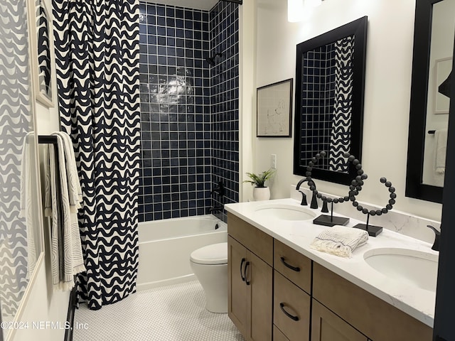 full bathroom with vanity, toilet, tile patterned floors, and tiled shower / bath