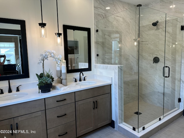 bathroom with an enclosed shower, tile patterned floors, and vanity