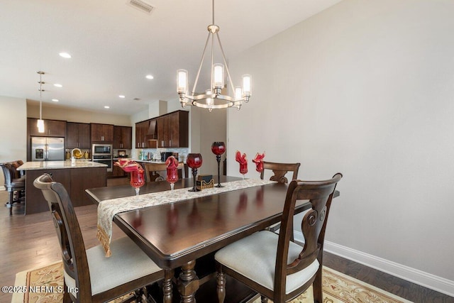 dining room with hardwood / wood-style floors