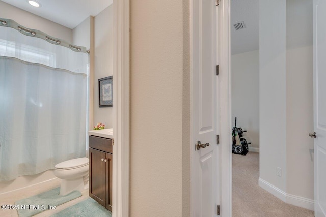 full bathroom with vanity, toilet, and shower / tub combo