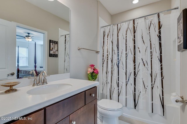 full bathroom with vanity, shower / bathtub combination with curtain, and toilet