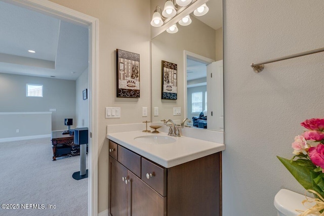 bathroom featuring vanity and toilet