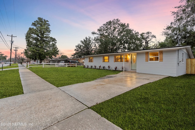 view of front of home with a yard