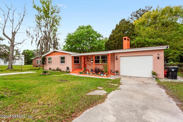 single story home featuring a front yard and a garage