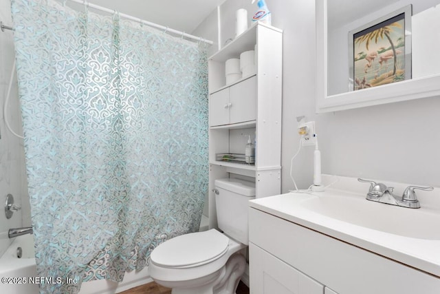 full bathroom featuring vanity, toilet, and shower / bath combo with shower curtain