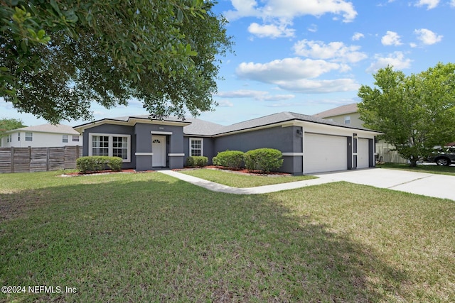 ranch-style home with a garage and a front lawn