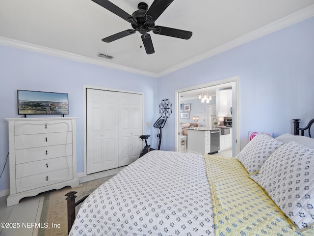 bedroom featuring a closet, ceiling fan, and crown molding