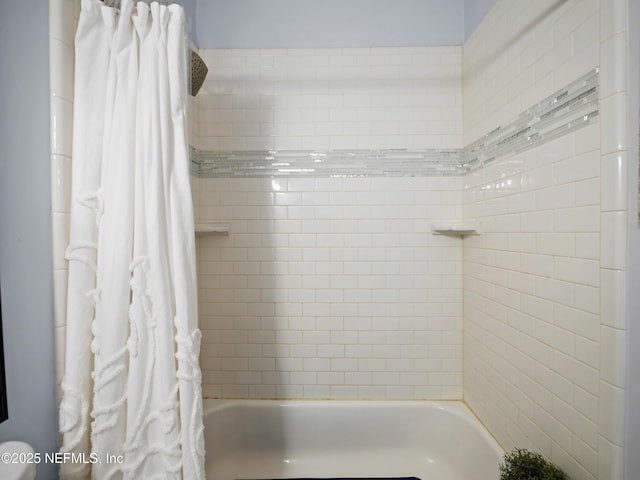 bathroom featuring shower / bath combination with curtain