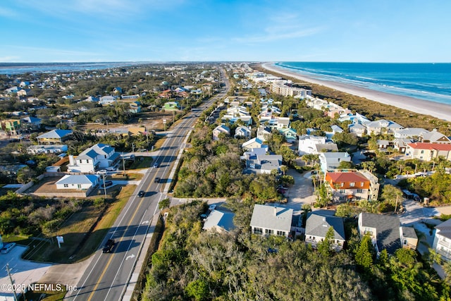 drone / aerial view with a water view and a view of the beach