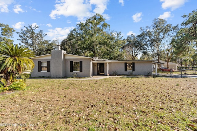 single story home with a front yard