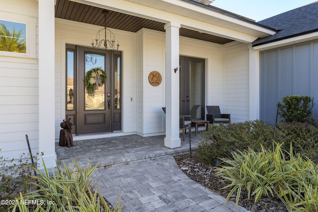 entrance to property featuring covered porch