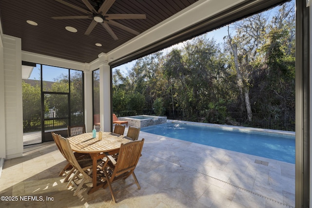 view of pool with an in ground hot tub, ceiling fan, and a patio