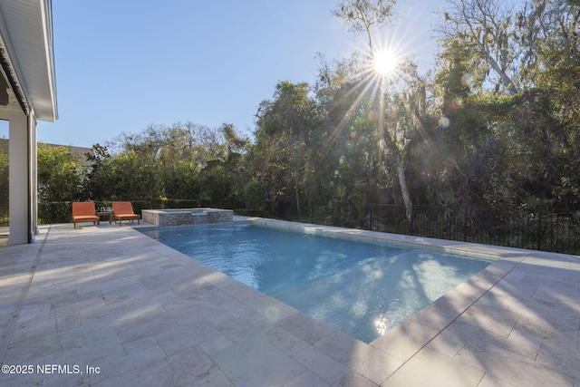 view of pool featuring an in ground hot tub and a patio area