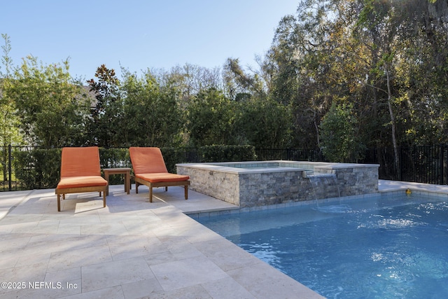 view of pool featuring an in ground hot tub and a patio area