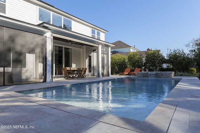 view of pool featuring ceiling fan and a patio