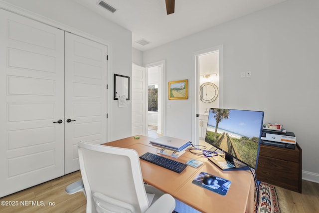 office area with ceiling fan and light wood-type flooring