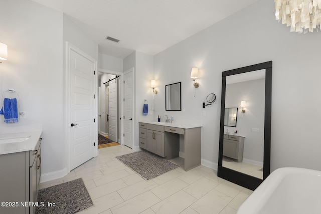 bathroom with a tub to relax in and vanity