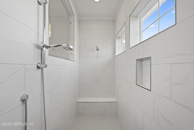 bathroom featuring tiled shower