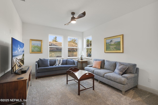 carpeted living room featuring ceiling fan