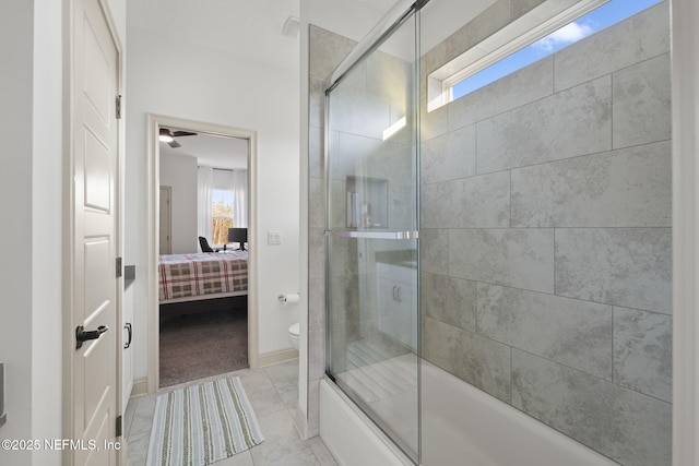 bathroom with bath / shower combo with glass door, tile patterned floors, and toilet