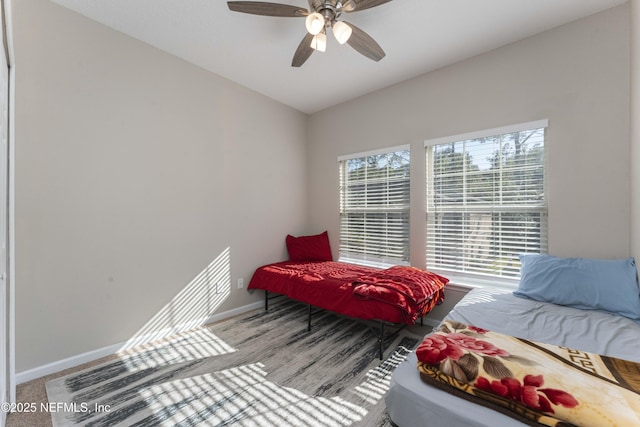 bedroom with ceiling fan and vaulted ceiling