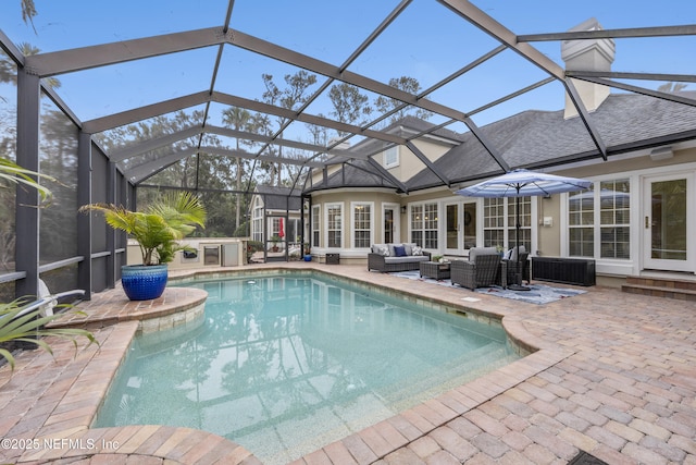 outdoor pool with a patio area, french doors, outdoor lounge area, and glass enclosure