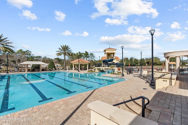 view of swimming pool with a gazebo and a patio area